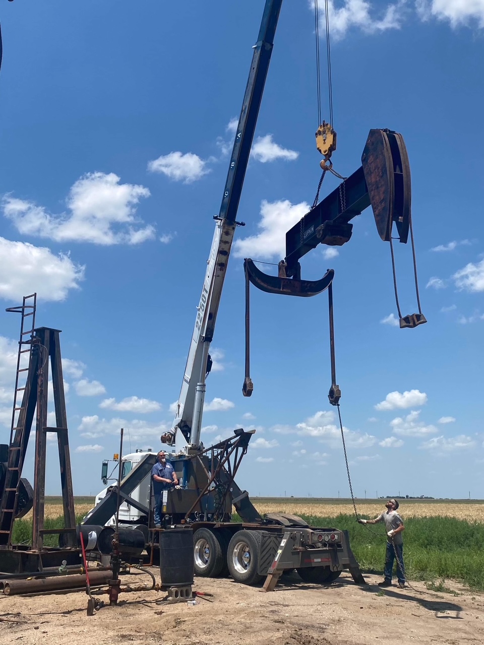 A pumping unit being removed via a crane