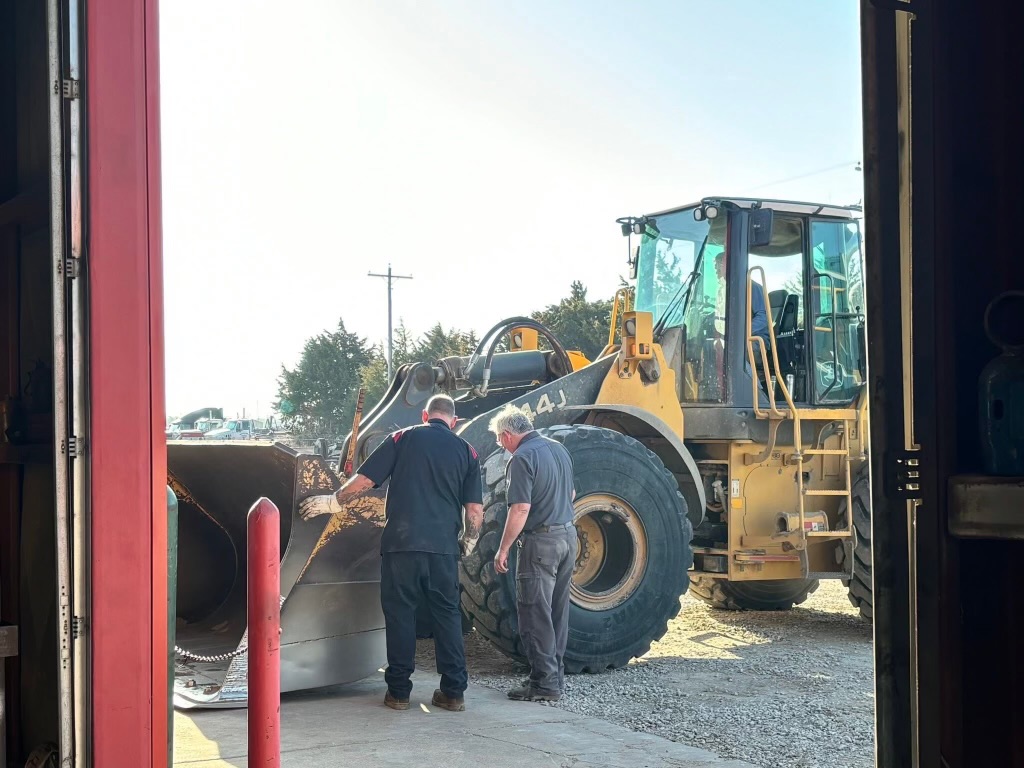 A front end loader having it's housing unit inspected